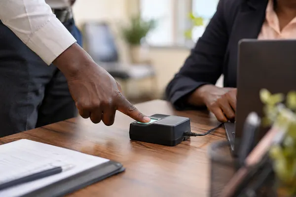 Fingerprint reader on a registration desk