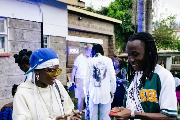 Two people talking at an outdoor event in Nairobi