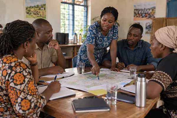Community programme team discussing a project
