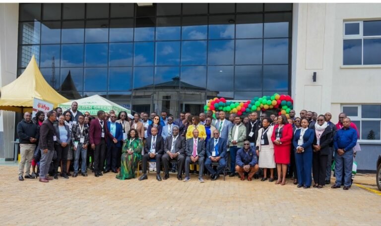 Karatina University staff and guests in front of the administration building